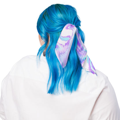 Person with blue hair wearing a colorful headband on a white background