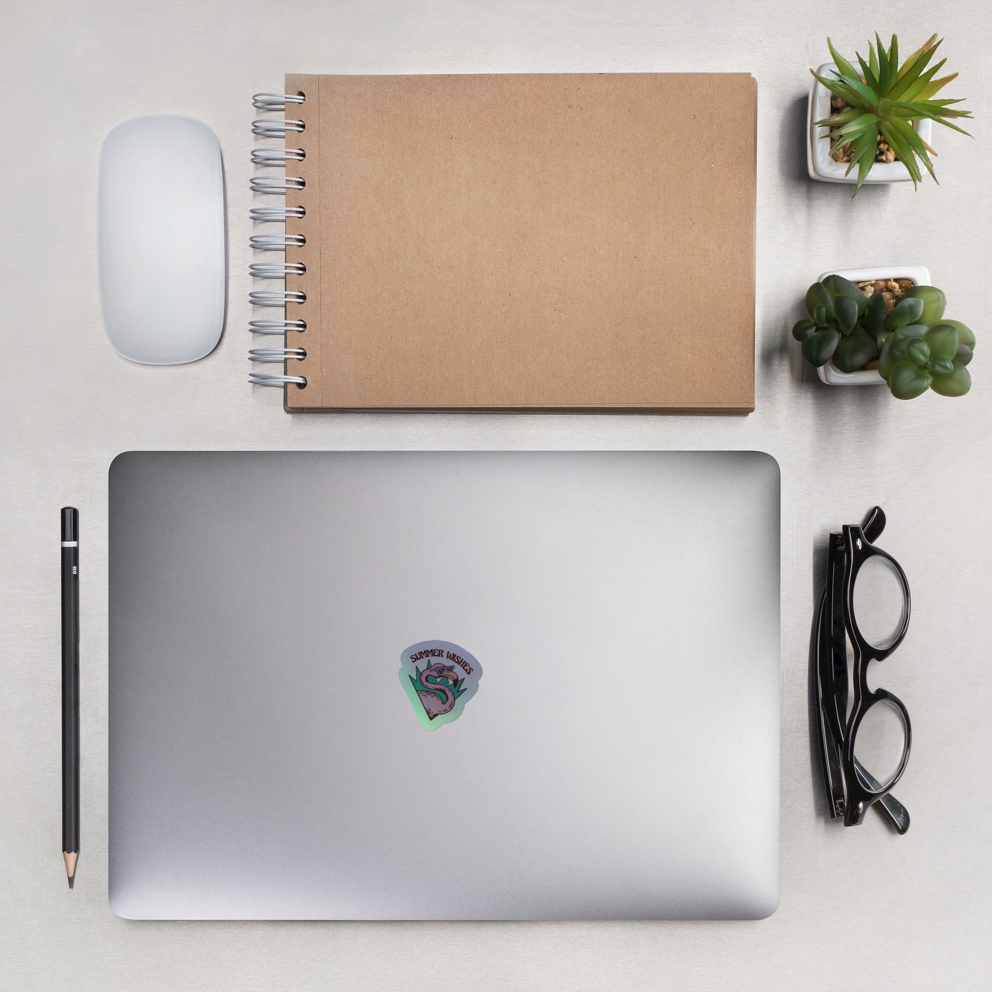 Silver laptop with colorful Holographic stickers V2 on lid