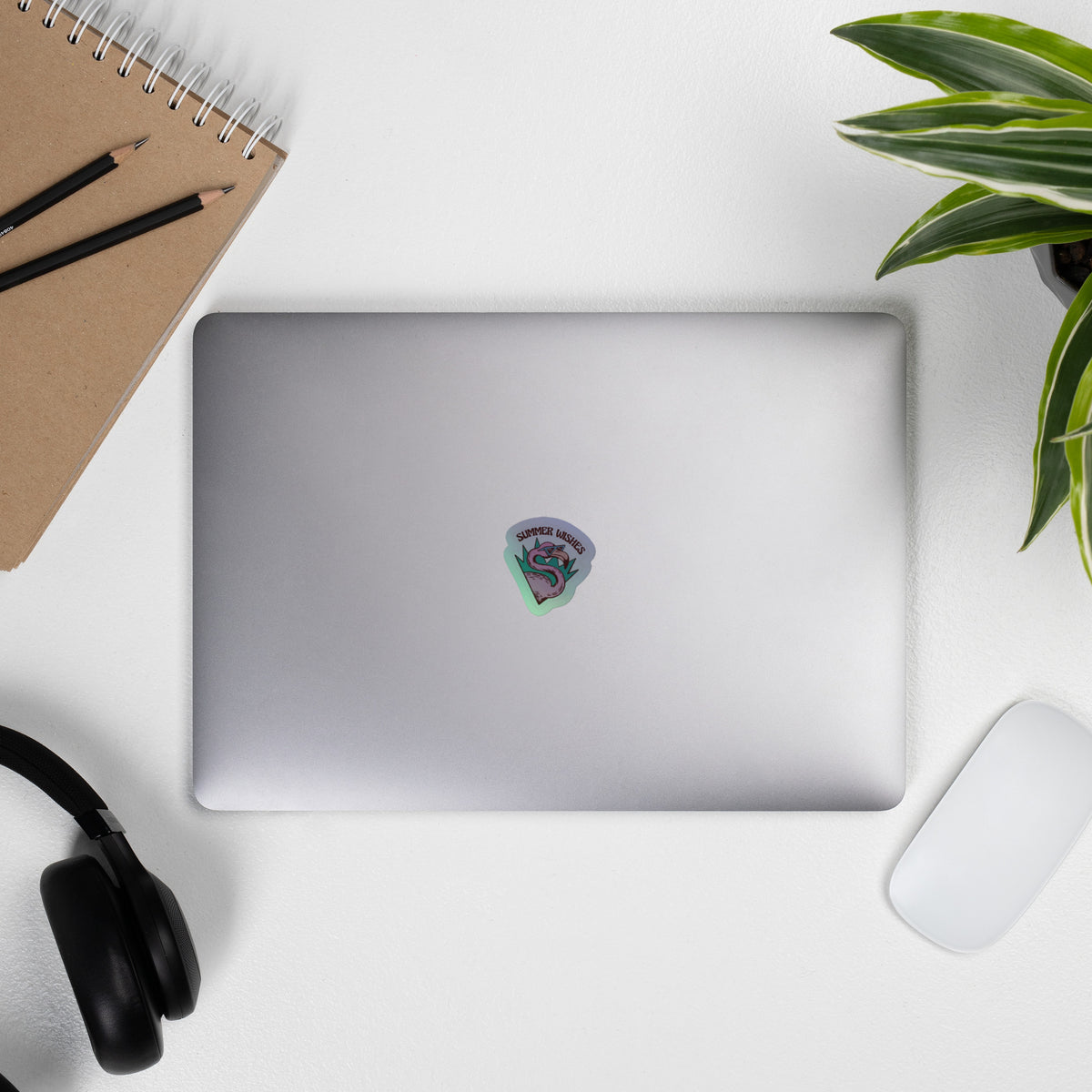Silver laptop with pink and green dragon holographic sticker from V2 collection